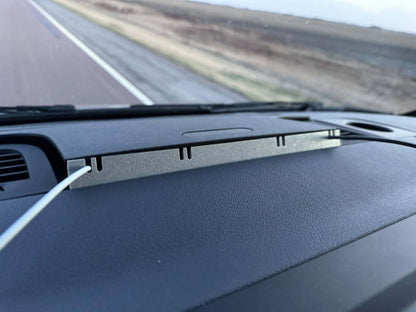 Car dashboard with a view of a road ahead